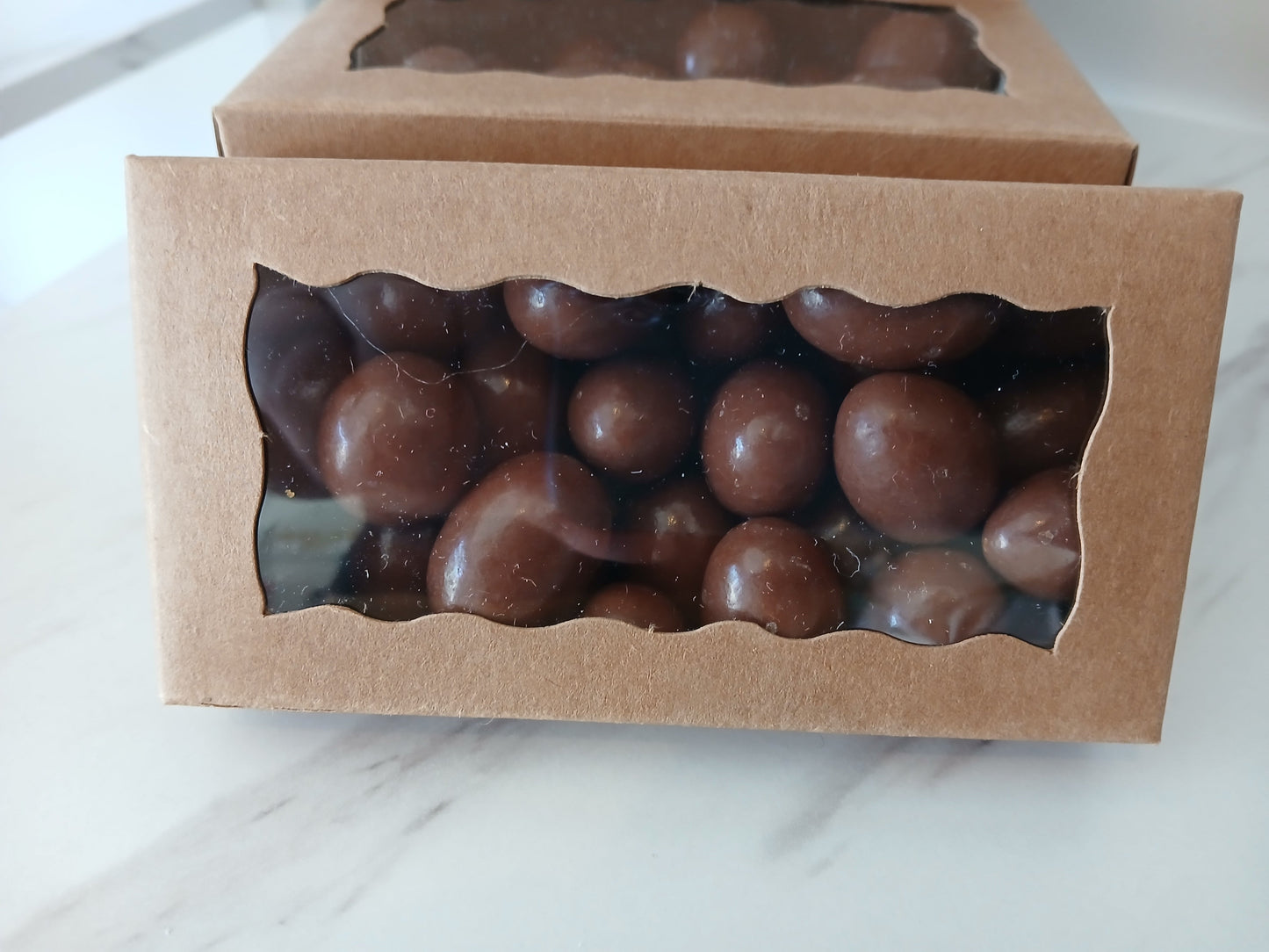 Amandes roties enrobées de chocolat au lait infusé au café (100g)